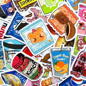 May include: A collection of colorful stickers featuring various food and drink items. Stickers include a Capri-Sun orange drink, a jar of kimchi, a honey packet with a bear, and a Japanese pancake. Other stickers include Oreo cookies and ice cream.