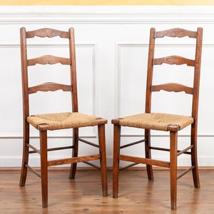 Pair of Antique English Oak Ladderback Chairs with Rush Seats 19th Century.
