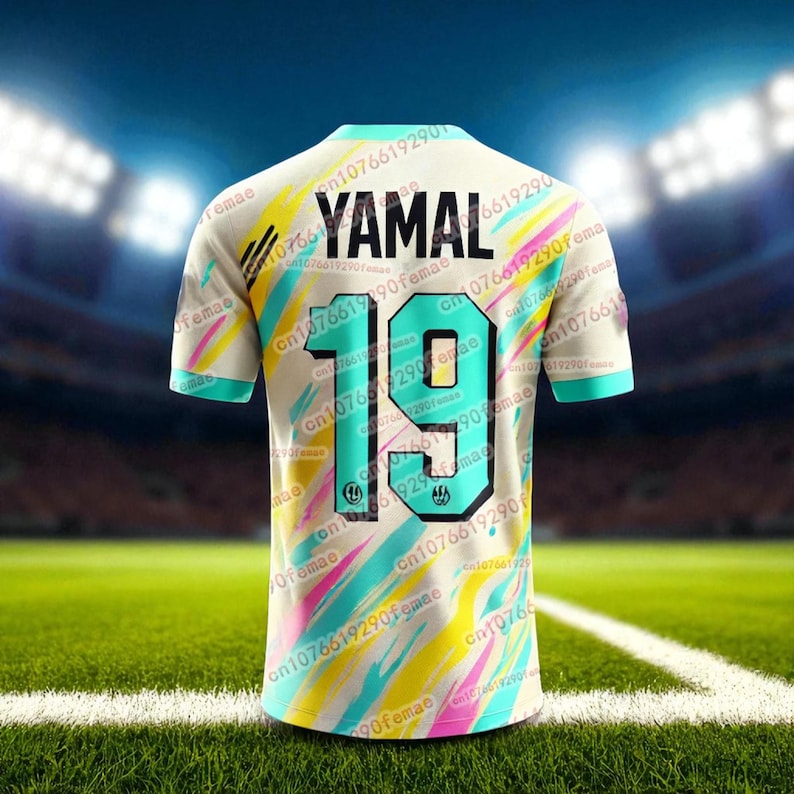 May include: A cream-colored soccer jersey with the name "YAMAL" and the number "19" on the back. The jersey has a colorful design with teal, yellow, and pink diagonal stripes. The sleeves and collar are teal.