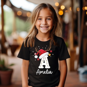 Personalized Christmas Kids Shirt, Kids Name Shirt For Christmas, Holiday Santa Hat T-Shirt, Family Matching Xmas Outfit, Gift for Kids image 2