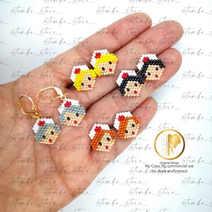 Puede incluir: Una colección de pendientes de enfermera con cuentas en varios tonos de piel y colores de cabello, incluyendo rubio, negro y rojo. Los pendientes son hexagonales y tienen ganchos dorados. La imagen también incluye el texto "Tembo Store".