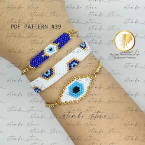 Puede incluir: Tres pulseras de cuentas con un diseño de ojo turco. Una pulsera es azul, otra blanca y la tercera tiene forma ovalada. Las pulseras tienen cierres y detalles dorados. El texto "PDF PATTERN #39" es visible.