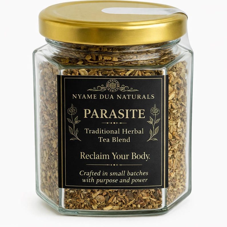 May include: A hexagonal glass jar with a gold lid filled with a brown herbal tea blend. The jar has a black label with the text "PARASITE Traditional Herbal Tea Blend" and "Reclaim Your Body."