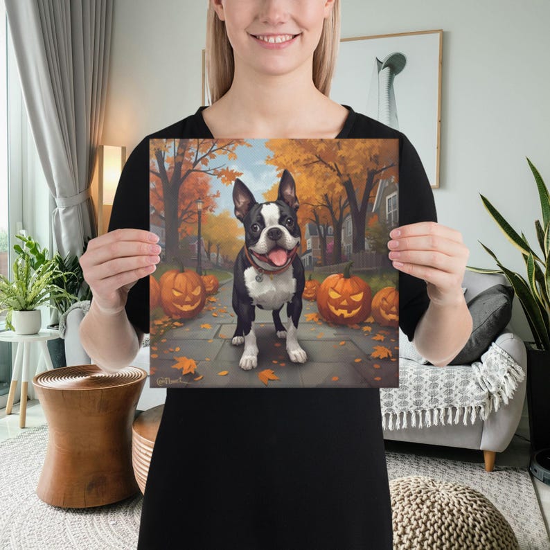 May include: A square canvas print featuring a Boston Terrier dog standing on a sidewalk lined with carved pumpkins and autumn leaves. The dog is black and white with a red collar. The background shows a street with orange trees.