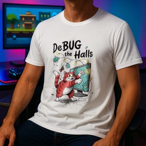 May include: White t-shirt featuring a cartoon cat in red and white, interacting with a computer screen. The screen is surrounded by bugs and fairy lights, with the text "DeBUG the Halls" above the design.