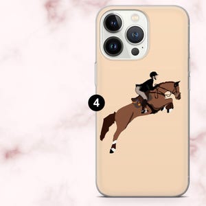 May include: A phone case with a brown horse and rider illustration. The horse is jumping over an obstacle. The rider is wearing black. The case has a light tan background and a clear border.