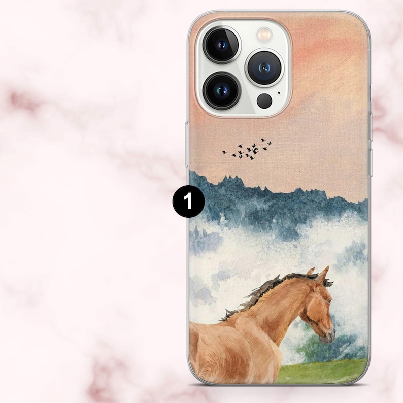 May include: A clear phone case with a watercolour painting of a brown horse in a landscape with mountains, birds, and a sunset. The case has a clear border and a camera cutout.