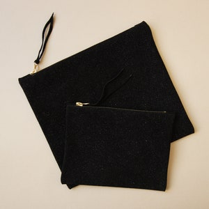 large and small size sparkling black leather clutch