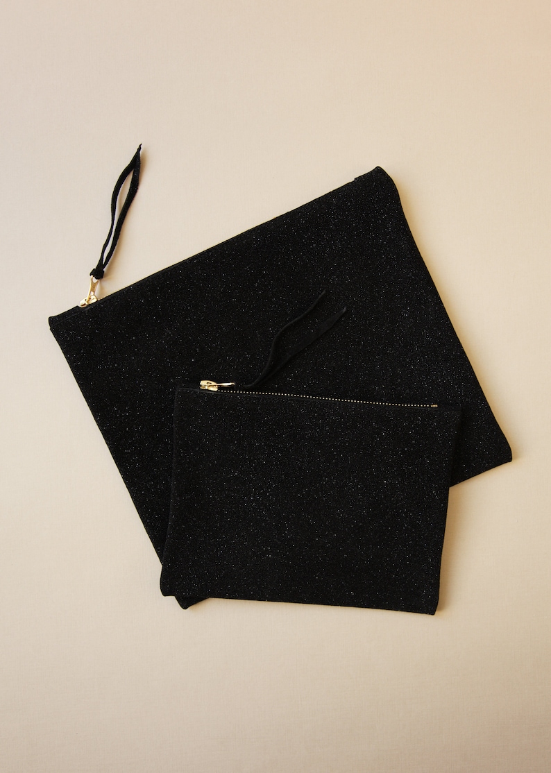 large and small size sparkling black leather clutch