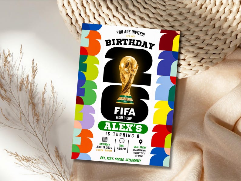 May include: A rectangular birthday invitation card featuring a large black number 26 with a gold FIFA World Cup trophy in the center. The border has colorful geometric shapes. Text includes YOU ARE INVITED, BIRTHDAY, ALEX'S IS TURNING 8, and event details.
