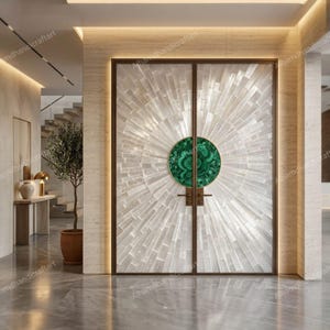 May include: Double doors with a sunburst design made of white tiles. A large, circular, green malachite door handle is centered on the doors. The doors are framed in a dark bronze color and are set in a modern entryway.