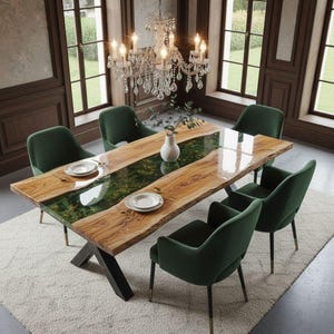 May include: A wooden dining table with a green epoxy river design, surrounded by six green velvet chairs. The table is set with white plates and a vase. A crystal chandelier hangs above, and the room has large windows.