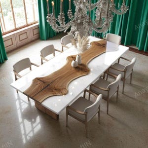 May include: A modern dining table with a white surface and a natural wood centerpiece. The table is surrounded by eight beige chairs. A large chandelier hangs above the table, and green curtains are in the background.