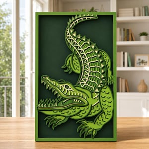 May include: A rectangular wall art piece featuring a multi-layered, laser-cut wooden alligator in shades of green and yellow. The design showcases a stylized, textured alligator with an open mouth, set against a dark green background within a frame.