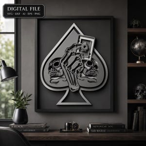 May include: A digital file featuring a layered graphic of a spade suit symbol containing a skeletal hand holding an ace of spades playing card, flanked by two skulls. The design is rendered in shades of grey and black with a 3D effect.