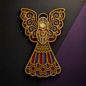 May include: A layered wooden angel ornament featuring intricate gold-toned filigree cutouts over deep purple and red backing. The design includes a halo, stylised wings with swirling patterns, a central star emblem, and a skirt with star motifs.