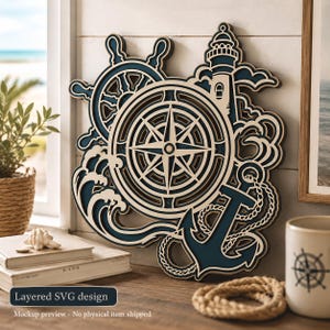 May include: A multi-layered wall art piece featuring a nautical theme with a central compass rose, a ship's wheel, a lighthouse, an anchor with rope, and stylized ocean waves. The design uses contrasting dark blue and cream-colored layers.