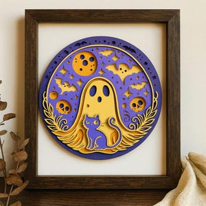 May include: A layered wooden Halloween decoration in a dark brown frame. The artwork features a yellow ghost, a purple cat, bats, skulls, and a moon against a purple and yellow background. The design is circular and has a detailed, layered appearance.