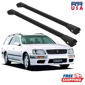 May include: Black roof rack crossbars are displayed above a white station wagon. The image shows the car's front and side profile, with the roof rack bars positioned on top. The logo "RR USA" is visible in the top right corner.