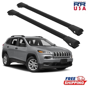 May include: A silver SUV with black roof racks. The vehicle has a black front grill and headlights. The image also includes the text "ROOF RACK USA" and "FREE SHIPPING".