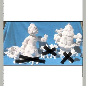 May include: White ceramic figurines of a girl and Santa Claus, with several small animal figurines. The girl holds a small object, and Santa holds a lantern. The figurines are unpainted and ready for customization.