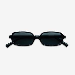 May include: Black rectangular sunglasses with dark lenses. The sunglasses have a thick, glossy frame and straight temples. The overall design is modern and minimalist, suitable for various styles.