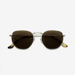 May include: Gold-framed sunglasses with dark brown lenses. The sunglasses have a rounded, geometric shape. The temples are a light brown color with the word "AIRO" printed on the right temple. The sunglasses are set against a white background.