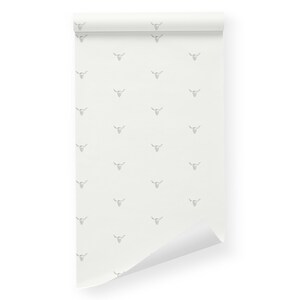 May include: A white wallpaper roll with a repeating pattern of gray bull skulls.