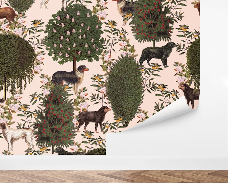 May include: A pink background with a repeating pattern of trees, flowers, and dogs. The trees are green with pink flowers and red berries. The dogs are black, brown, and white.
