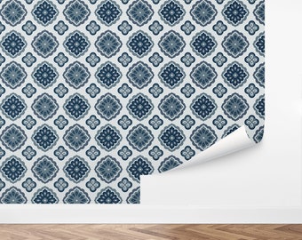 May include: Blue and white patterned wallpaper with a repeating geometric design. The wallpaper is shown partially rolled up on a white wall.
