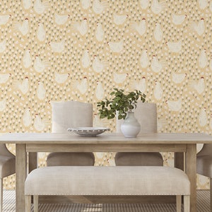 May include: A dining room with a light yellow wallpaper featuring a repeating pattern of white chickens and small white flowers. The wallpaper is on the wall behind a wooden table with two chairs and a bench.