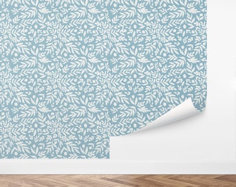 May include: A seamless pattern wallpaper with a repeating design of white stylized leaves and small circles on a light blue background.