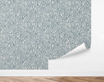 May include: A blue and white wallpaper with a geometric pattern of small, irregular shapes. The pattern resembles a mosaic or a cracked surface.