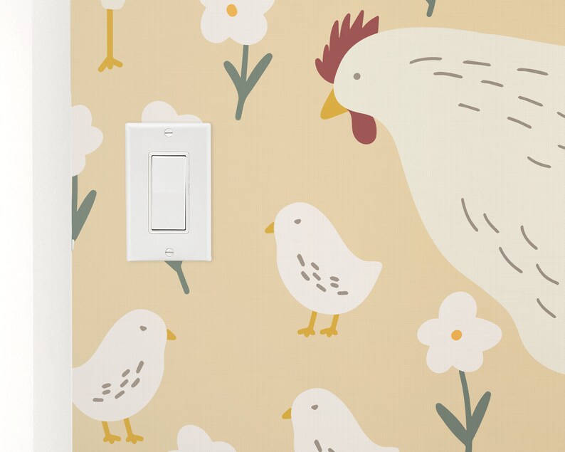 May include: A light switch with a white background and a beige wall with a pattern of white flowers, green stems, and white chicks with yellow beaks. A white hen with a red comb and beak is in the upper right corner.