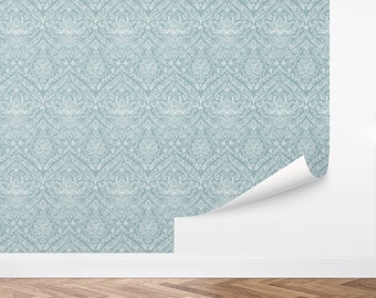 May include: A light blue wallpaper with a white damask pattern. The pattern is a repeating design of intricate floral and geometric shapes.
