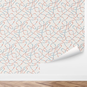 May include: A seamless pattern wallpaper featuring a repeating design of red and blue lines that are intertwined and form abstract shapes on a white background.