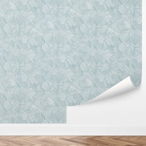 May include: A light blue wallpaper with a repeating pattern of white lines forming abstract shapes.