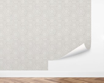 May include: A white wallpaper with a geometric pattern of overlapping hexagons in a light gray color.