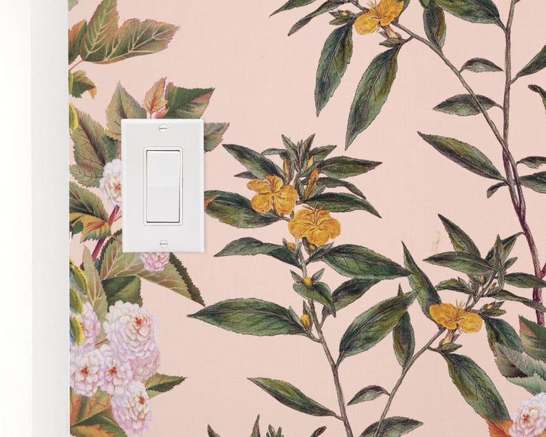 May include: A white light switch with a single toggle switch on a pink wall with a floral wallpaper pattern featuring yellow flowers and green leaves.