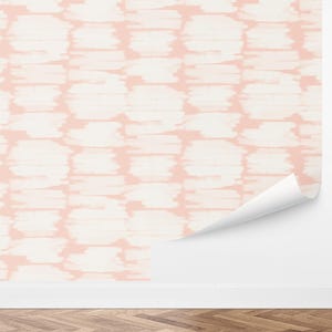 May include: Pink and white patterned wallpaper with a repeating abstract design. The pattern resembles a tie-dye effect.