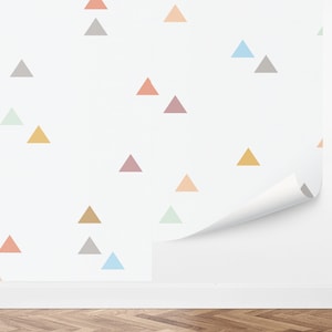 May include: A white wall with a repeating pattern of colorful triangles. The triangles are in shades of pink, orange, yellow, green, blue, and gray.