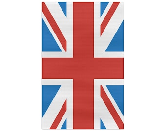 May include: A red, white, and blue flag with the Union Jack design. The flag is made of fabric and has a slightly textured surface.