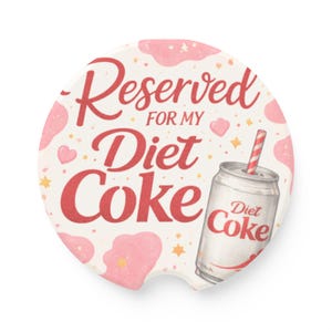 May include: Round car coaster with a white background and pink accents. The text "Reserved for my Diet Coke" is in red script. A Diet Coke can with a red and white straw is on the right.