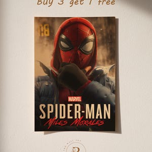 May include: A poster featuring Spider-Man Miles Morales in a red and black mask and hood, with a blue jacket. The Marvel logo is visible, along with the text "SPIDER-MAN Miles Morales". The poster has the text "Buy 3 get 1 free".