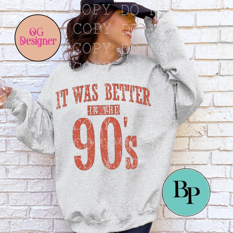 May include: A light gray long-sleeve sweatshirt featuring the distressed red text IT WAS BETTER IN THE 90's printed on the front. The garment has a crew neckline and long sleeves, showcasing a bold, vintage-inspired graphic design across the chest.