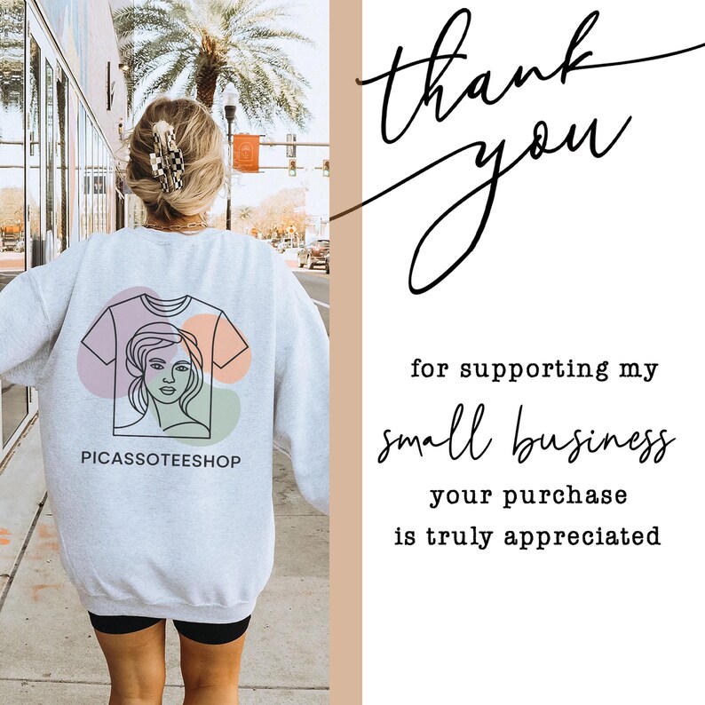 a person walking down a street, wearing a white sweatshirt with a graphic design on the back. The person is also carrying a handbag. The image includes text that reads "Thank you for supporting my small business your purchase is truly appreciated".