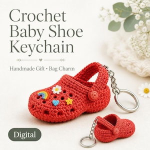 May include: A red crochet baby shoe keychain featuring a silver metal ring and chain. The shoe is decorated with small, colorful stitched appliques including a rainbow, a white daisy, a light blue heart, and a yellow star. Text reads Crochet Baby Shoe Keychain.