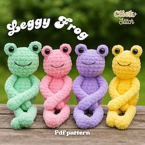 May include: Four colorful crochet frog toys in green, pink, purple, and yellow, each with a smiling face and crossed arms. The image includes the text "Leggy Frog" and "Pdf pattern". The background is a blurred green.