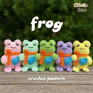 May include: Five crocheted frog toys in pink, mint green, green, purple, and yellow. Each frog has an orange scarf and a blue heart-shaped belly. The word "frog" is above the frogs, and "crochet pattern" is below.