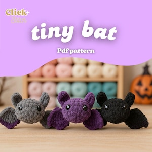May include: Three crocheted bats in grey, purple, and black, with large eyes and outstretched wings, are displayed on a wooden surface. The image includes the text "tiny bat" and "Pdf pattern", suggesting a craft project.